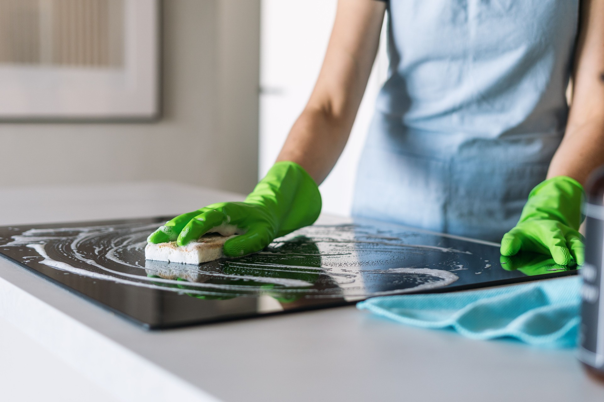 Efficient cleaning of a modern induction stove in a stylish kitchen